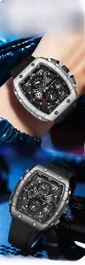 Detail of tonneau-shaped quartz watch with a skeleton dial and black rubber strap