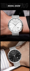 Close-up of a men's quartz watch with a dodecagonal bezel and silver mesh strap