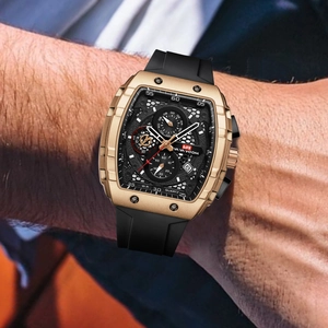 Men's golden tonneau quartz watch with black rubber strap and skeleton dial chronograph