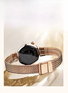 Rose gold mesh watch strap with stainless steel case back by Hannah Martin