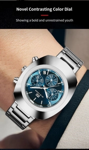 Macro shot of stainless steel chronograph watch with sunray blue dial on wrist