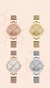 Detail of four elegant women's mesh strap watches in rose gold, gold and silver