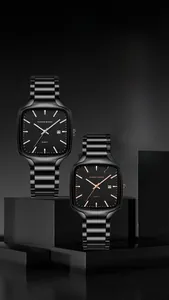 Macro shot of square quartz watches with stainless steel bands and date display