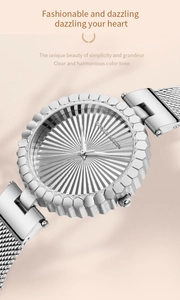 Detailed close-up of a silver ladies watch with sunray dial and honeycomb texture bezel