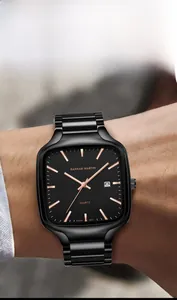 Macro shot of a black square quartz watch on a wrist featuring a date window display