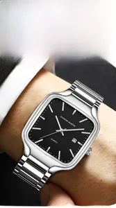 Close-up of square quartz watch with black dial and silver steel strap worn on wrist