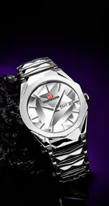 Detail of multi-faceted geometric watch case with double calendar window on silver dial