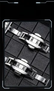 Close-up of dual-press silver stainless steel butterfly deployment clasp for watch strap