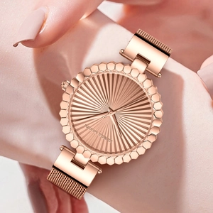 Hannah Martin rose gold women's mesh watch with sunray dial and fluted bezel detail