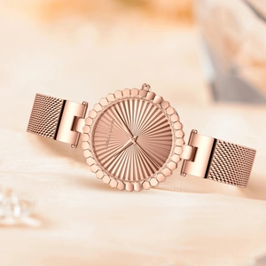 Elegant rose gold women's watch with sunray dial and Milanese mesh steel strap