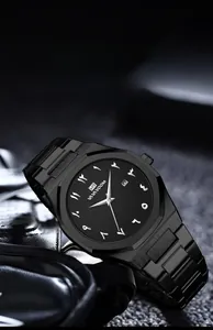 Detail of all-black men's quartz watch with octagonal bezel and Arabic numeral dial