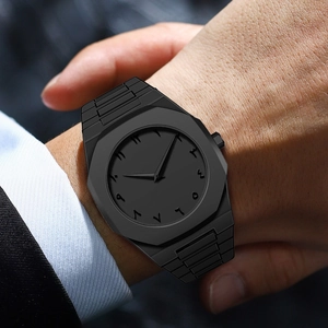 Close-up of black matte watch with octagonal bezel and Eastern Arabic numerals on wrist