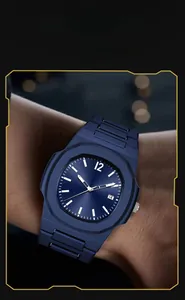 Detailed close-up of a blue octagonal sports watch with date display on a male wrist