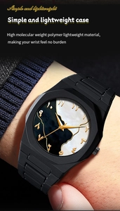 Detail of lightweight black polymer quartz watch with Arabic numerals and marble dial