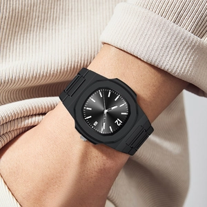 Men's sporty black quartz watch with octagonal bezel and integrated strap on wrist