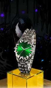 Detail of green sunray dial watch with silver metal claws and skeletal steel band