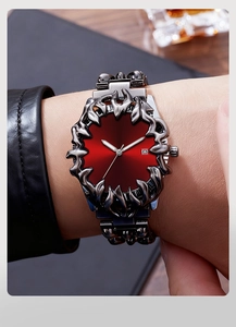 Macro view of men's dark grey punk watch with red sunray dial and claw-shaped metal bezel