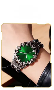 Detail of custom claw bezel watch with green sunray dial and calendar display