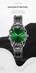 Macro detail of silver embossed watch strap with emerald green sunray dial and date window