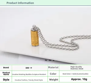 Detailed view of spinning stainless steel cylinder necklace with golden engraved sutra text