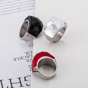 Chunky stainless steel punk rings with oversized black, clear, and red faceted glass gems
