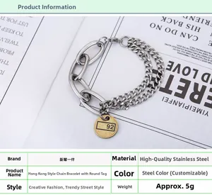 Détail d'un bracelet à mailles cubaines en acier inoxydable avec pendentif rond