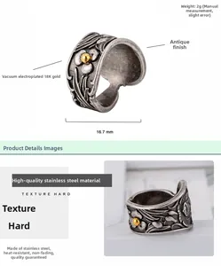 Detailed view of vintage stainless steel floral relief ring with 18K gold bead and 16.7mm diameter