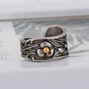 Vintage stainless steel wide floral relief ring with antique silver finish and gold accent