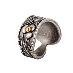 Vintage stainless steel wide ring with embossed floral relief and gold bead detail