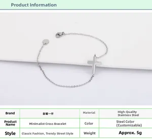Detailed view of polished stainless steel cross bracelet with lobster clasp and tag