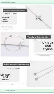 Detailed macro view of polished stainless steel cross pendant and adjustable lobster clasp