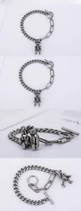 Detailed macro view of vintage silver teddy bear pendant with movable joints on chain link