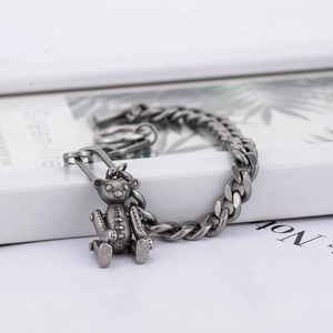 Vintage hip hop cuban chain bracelet featuring a retro 3D teddy bear charm in titanium steel