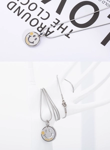 Detailed view of silver snake chain necklace with Love Life clover smiley pendant