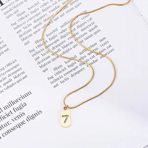 Golden number 7 pendant necklace on a sleek snake chain with a minimalist aesthetic