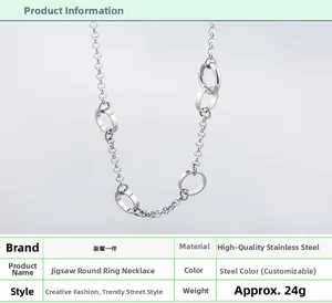 Detail view of silver stainless steel O-chain necklace with interlocking rings and specs