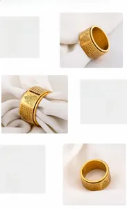 Macro detail of gold 316L stainless steel rotatable ring with engraved Buddhist scriptures