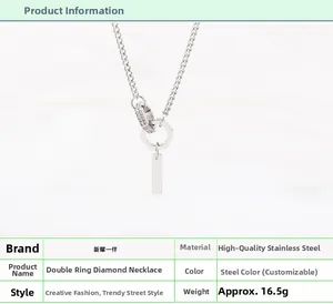 Macro shot of interlocking double ring pendant necklace in polished silver stainless steel