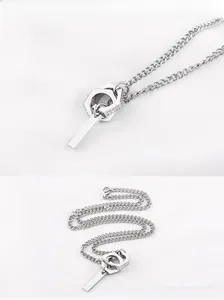 Detail of interlocking hexagonal rings with pavé stones and vertical bar on steel chain