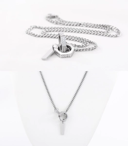 Detailed close-up of a silver intertwined necklace with a sparkling pavé hex nut pendant