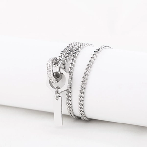 Silver interlocking double ring pendant necklace with crystals on cuban link chain