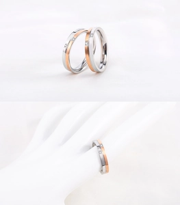 Detail of rose gold two-tone couple rings featuring geometric grooves and micro-inlaid diamonds