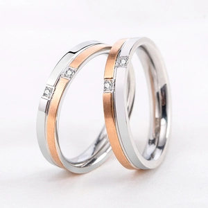 Polished silver and rose gold brushed stainless steel couple rings with crystals
