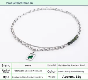 Detail shot of a stainless steel spliced double-layer necklace with green emerald pendant