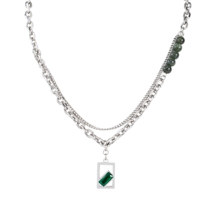 Punk style layered steel necklace with green crystal pendant and round bead accents
