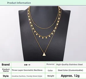 Detail view of 3-layered gold stainless steel necklace with triangle and disc pendants
