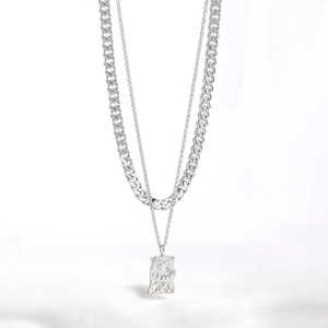 Dual layer stainless steel Cuban chain necklace with textured rectangular lava pendant