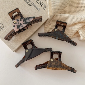French chic acetate hair claws with gold B metal letter in four marble patterns
