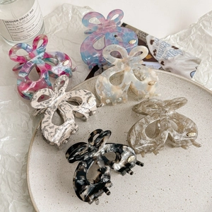 Hollow butterfly acetate hair claws in six colors including blue and cream white