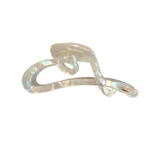 Iridescent heart shark hair claw clip with pearl and golden logo on white background